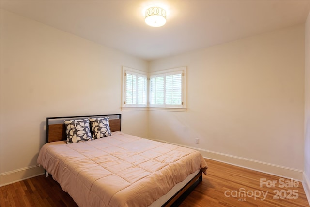 5162 Lincrest Pl, Charlotte, NC 28211 - bedroom with baseboards and wood finished floors
