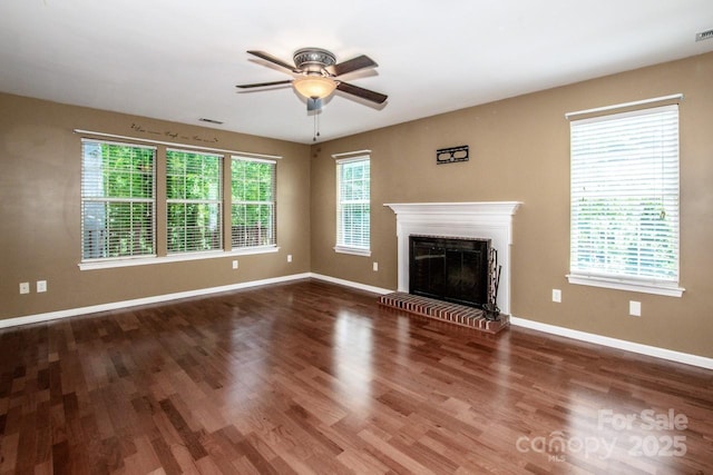 292 Rose St, Mooresville, NC 28117 - unfurnished living room with a ceiling fan, baseboards, wood finished floors, and a brick fireplace