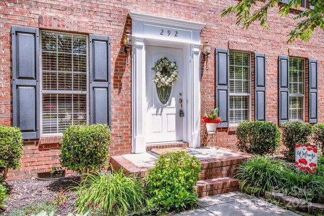 292 Rose St, Mooresville, NC 28117 - doorway to property featuring brick siding