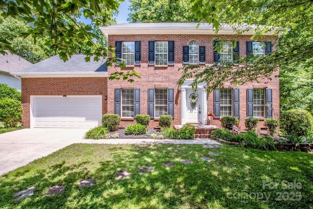 292 Rose St, Mooresville, NC 28117 - view of front of home with brick siding, concrete driveway, a garage, and a front lawn