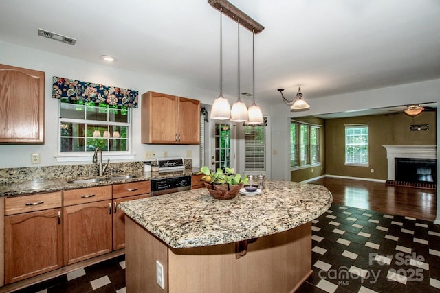 292 Rose St, Mooresville, NC 28117 - kitchen featuring a sink, open floor plan, a kitchen island, hanging light fixtures, and dishwasher