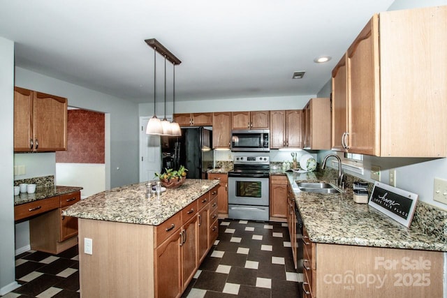 292 Rose St, Mooresville, NC 28117 - kitchen with appliances with stainless steel finishes, dark floors, a sink, a kitchen island, and light stone counters