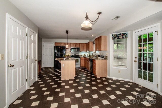 292 Rose St, Mooresville, NC 28117 - kitchen with black appliances, a kitchen island, baseboards, dark flooring, and a sink