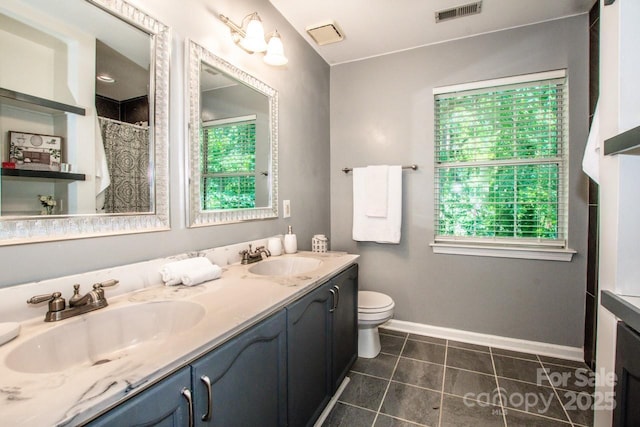 292 Rose St, Mooresville, NC 28117 - bathroom with toilet, baseboards, tile patterned flooring, double vanity, and curtained shower