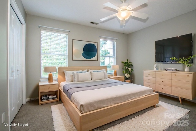 292 Rose St, Mooresville, NC 28117 - bedroom featuring light colored carpet, a closet, and a ceiling fan