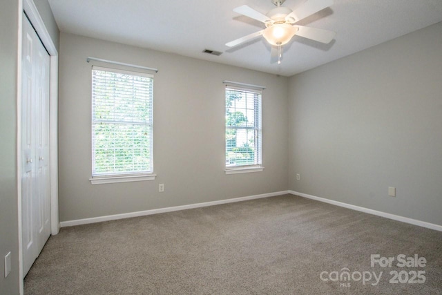 292 Rose St, Mooresville, NC 28117 - unfurnished bedroom with carpet flooring, a closet, and baseboards