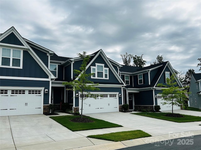 934 Prince Garrett Way, Denver, NC 28037 - craftsman house with concrete driveway, stone siding, an attached garage, and board and batten siding