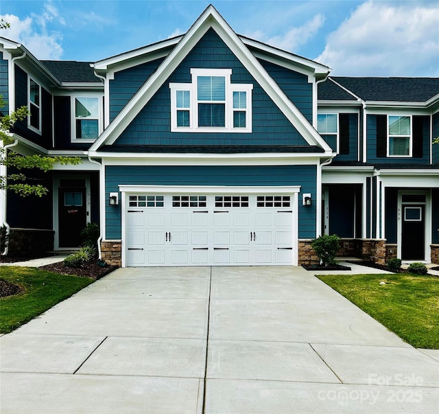 934 Prince Garrett Way, Denver, NC 28037 - craftsman-style home with an attached garage, driveway, stone siding, and a front yard