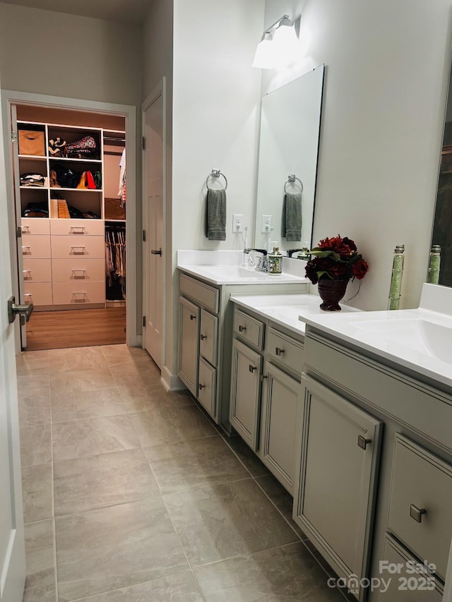 934 Prince Garrett Way, Denver, NC 28037 - bathroom featuring a spacious closet, double vanity, and tile patterned floors