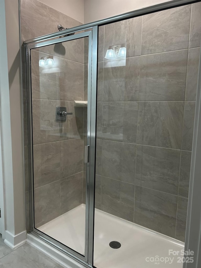 934 Prince Garrett Way, Denver, NC 28037 - full bathroom featuring a stall shower and baseboards