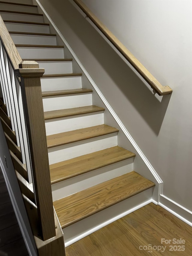 934 Prince Garrett Way, Denver, NC 28037 - stairs featuring wood finished floors and baseboards