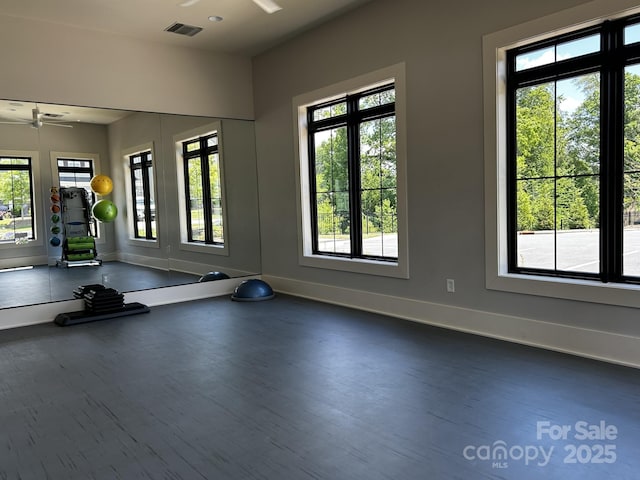 934 Prince Garrett Way, Denver, NC 28037 - workout area with a ceiling fan, plenty of natural light, baseboards, and dark wood-style floors