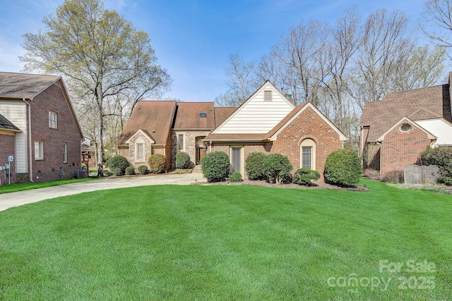 5108 Tedorill Ln, Charlotte, NC 28226 - view of front of property with concrete driveway, brick siding, and a front lawn