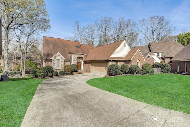 5108 Tedorill Ln, Charlotte, NC 28226 - view of front facade with driveway, a front yard, an attached garage, and brick siding
