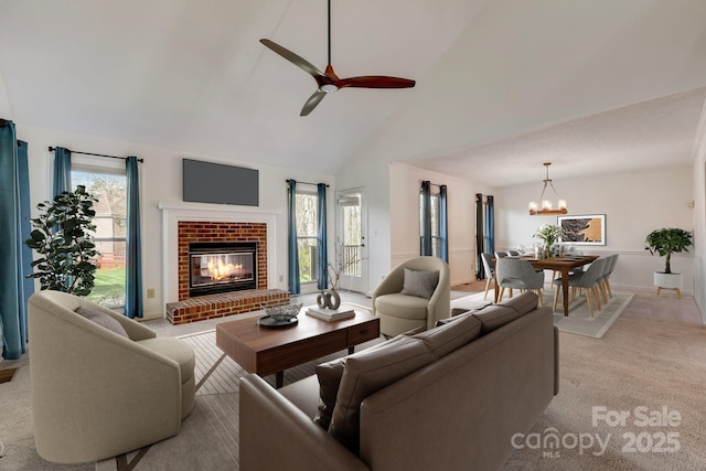 5108 Tedorill Ln, Charlotte, NC 28226 - living area featuring a brick fireplace, ceiling fan, high vaulted ceiling, light colored carpet, and a chandelier