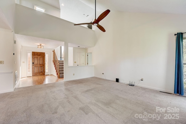 5108 Tedorill Ln, Charlotte, NC 28226 - unfurnished living room with carpet, high vaulted ceiling, stairway, baseboards, and ceiling fan