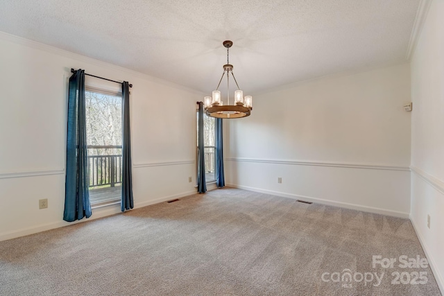 5108 Tedorill Ln, Charlotte, NC 28226 - carpeted spare room featuring a chandelier, a textured ceiling, ornamental molding, and baseboards