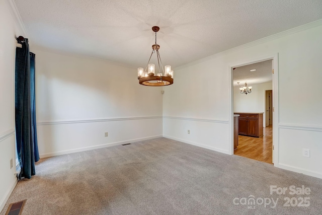 5108 Tedorill Ln, Charlotte, NC 28226 - empty room with a chandelier, carpet floors, ornamental molding, a textured ceiling, and baseboards