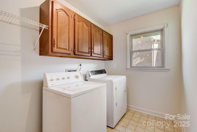 5108 Tedorill Ln, Charlotte, NC 28226 - laundry area featuring washer and clothes dryer, cabinet space, baseboards, and light tile patterned floors
