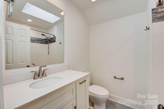 5108 Tedorill Ln, Charlotte, NC 28226 - full bathroom with a skylight, toilet, vanity, a tile shower, and recessed lighting