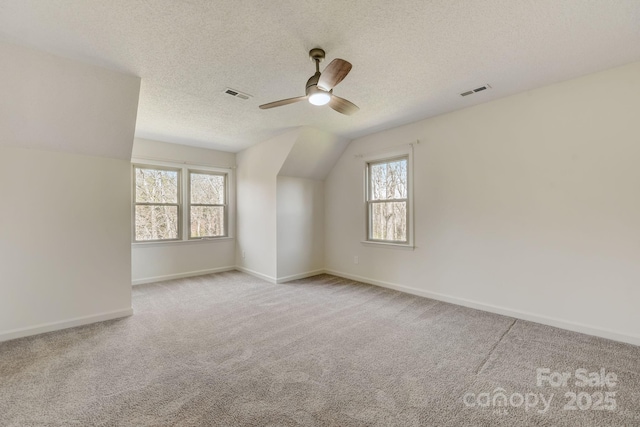 5108 Tedorill Ln, Charlotte, NC 28226 - carpeted empty room with a ceiling fan, plenty of natural light, baseboards, a textured ceiling, and lofted ceiling