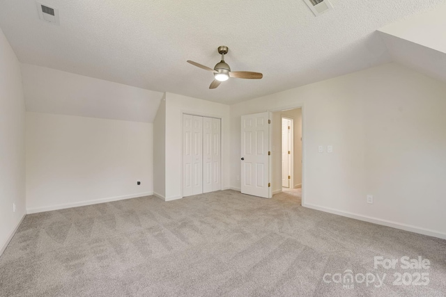 5108 Tedorill Ln, Charlotte, NC 28226 - additional living space featuring a ceiling fan, carpet flooring, vaulted ceiling, baseboards, and a textured ceiling
