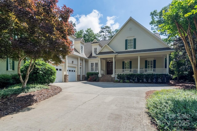 154 Pattersons Brg, New London, NC 28127 - view of front of home featuring a porch, concrete driveway, and an attached garage