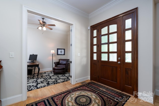 154 Pattersons Brg, New London, NC 28127 - foyer entrance featuring wood finished floors, crown molding, baseboards, and a ceiling fan