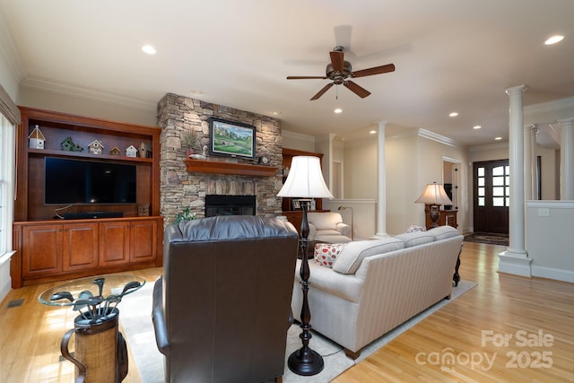 154 Pattersons Brg, New London, NC 28127 - living area with ornate columns, light wood-style floors, a ceiling fan, ornamental molding, and a stone fireplace