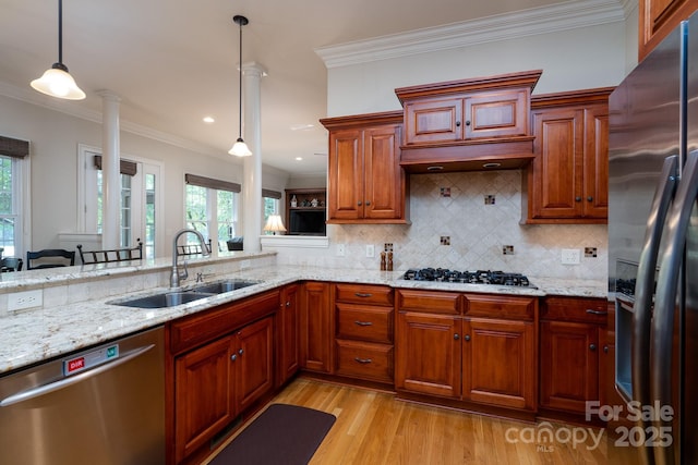154 Pattersons Brg, New London, NC 28127 - kitchen with appliances with stainless steel finishes, a sink, plenty of natural light, light wood-style floors, and crown molding