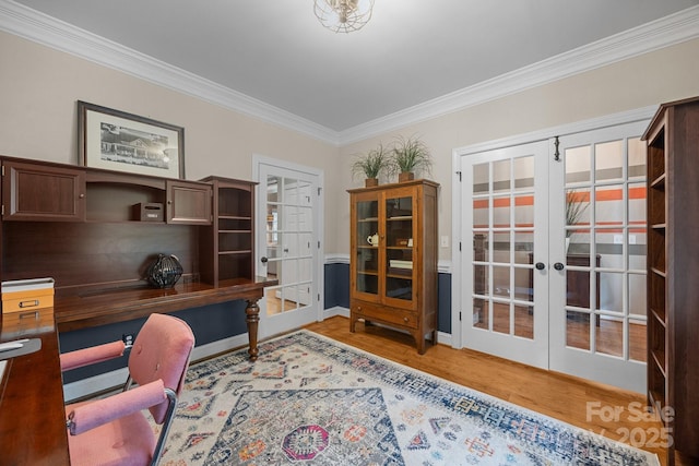 home office featuring french doors, crown molding, wood finished floors, and baseboards