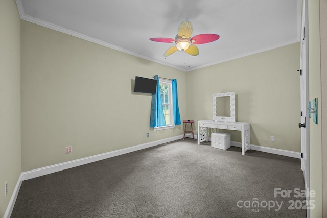 unfurnished bedroom with ornamental molding, baseboards, carpet floors, and ceiling fan