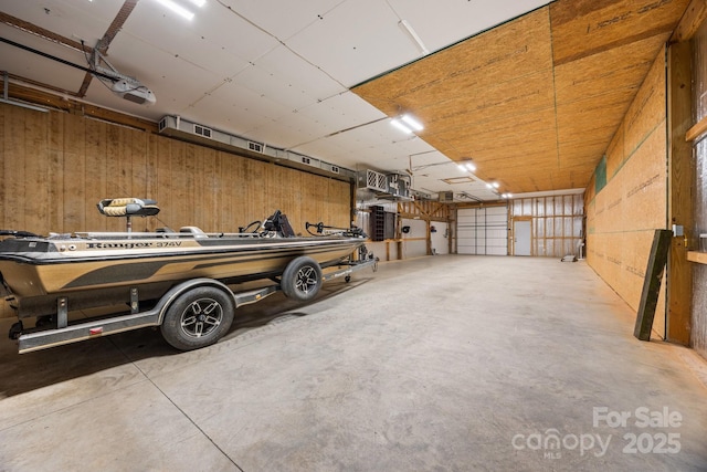 garage featuring wooden walls