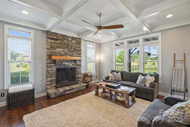 4941 Campobello Dr, Monroe, NC 28110 - living room with ceiling fan, dark wood finished floors, baseboards, beam ceiling, and a stone fireplace