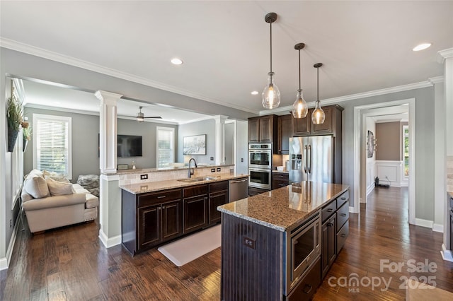 4941 Campobello Dr, Monroe, NC 28110 - kitchen featuring ornate columns, a sink, appliances with stainless steel finishes, a large island, and open floor plan
