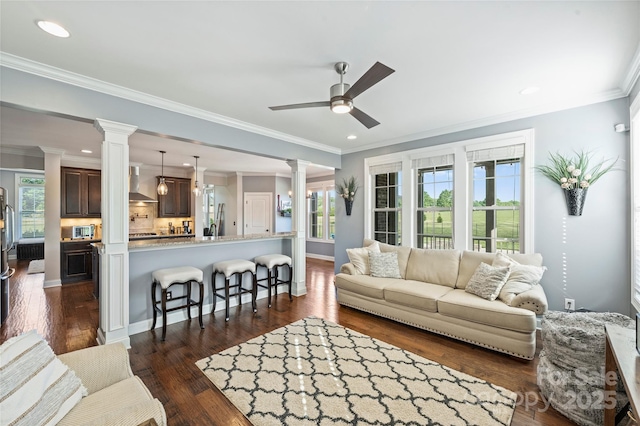 4941 Campobello Dr, Monroe, NC 28110 - living area featuring ornate columns, ceiling fan, ornamental molding, recessed lighting, and dark wood-type flooring