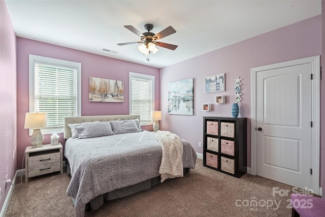 4941 Campobello Dr, Monroe, NC 28110 - carpeted bedroom with multiple windows, baseboards, and ceiling fan