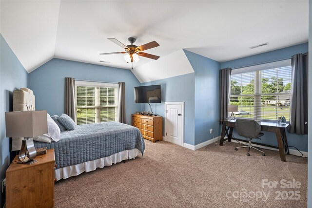 4941 Campobello Dr, Monroe, NC 28110 - carpeted bedroom featuring vaulted ceiling, multiple windows, baseboards, ceiling fan, and an office area