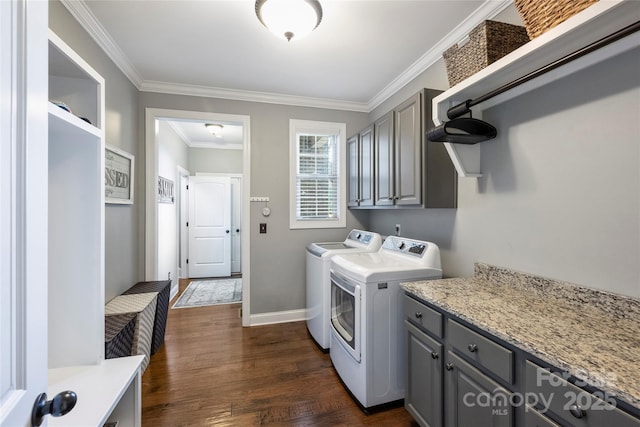 4941 Campobello Dr, Monroe, NC 28110 - laundry area with washer and dryer, cabinet space, ornamental molding, dark wood-style floors, and baseboards