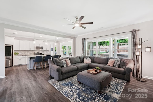 3218 Gilroy Dr, Fort Mill, SC 29707 - living area featuring ceiling fan, dark wood-type flooring, ornamental molding, and baseboards