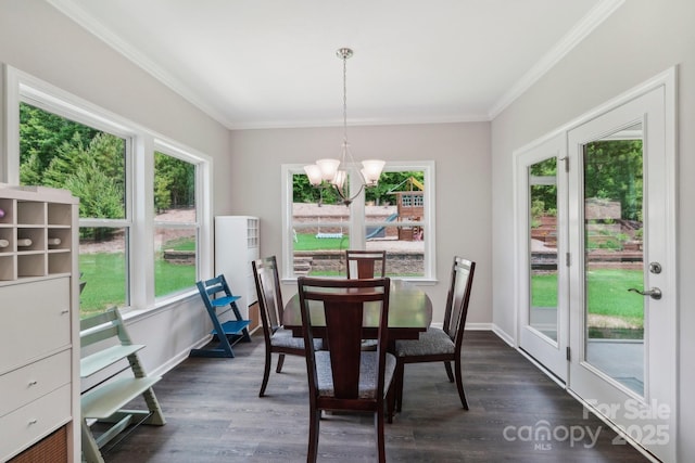 3218 Gilroy Dr, Fort Mill, SC 29707 - dining space featuring a chandelier, plenty of natural light, crown molding, and dark wood-style floors