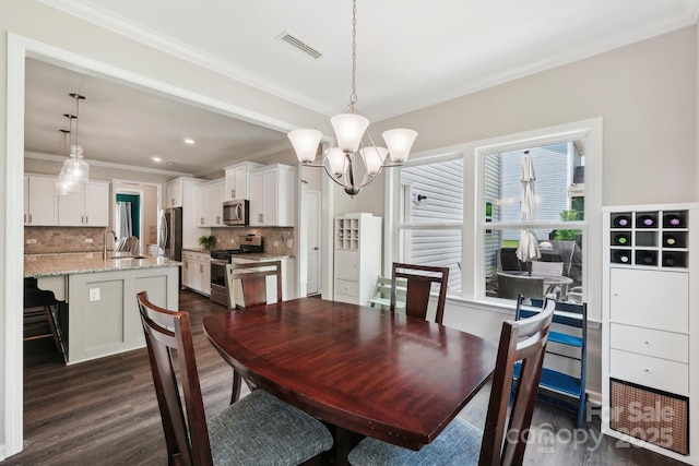 3218 Gilroy Dr, Fort Mill, SC 29707 - dining space featuring a chandelier, dark wood-style floors, crown molding, and recessed lighting