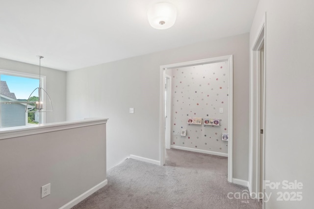 3218 Gilroy Dr, Fort Mill, SC 29707 - corridor with carpet, baseboards, a chandelier, and an upstairs landing