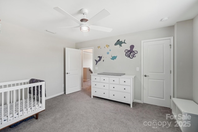 3218 Gilroy Dr, Fort Mill, SC 29707 - bedroom with carpet floors, a crib, ceiling fan, and baseboards