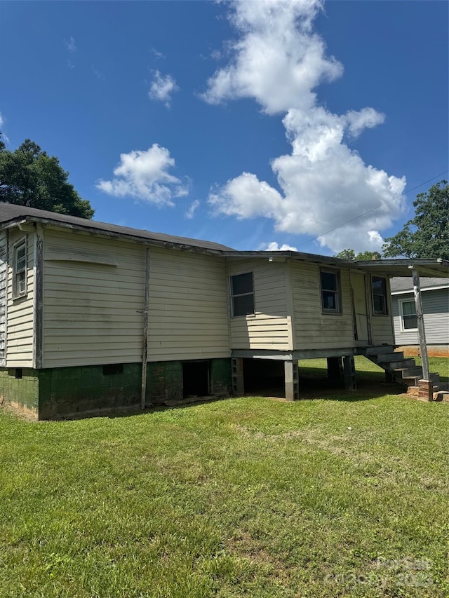 204 13th St, Belmont, NC 28012 - rear view of house featuring a lawn, crawl space, and entry steps