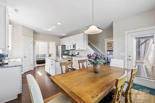 19 Wetland Way, Arden, NC 28704 - dining room featuring dark wood finished floors, stairway, and recessed lighting