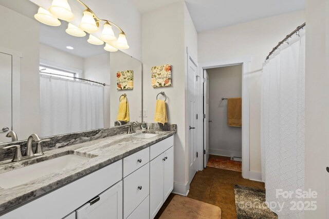 19 Wetland Way, Arden, NC 28704 - bathroom with double vanity, baseboards, tile patterned flooring, and curtained shower