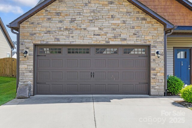 19 Wetland Way, Arden, NC 28704 - garage featuring driveway and fence