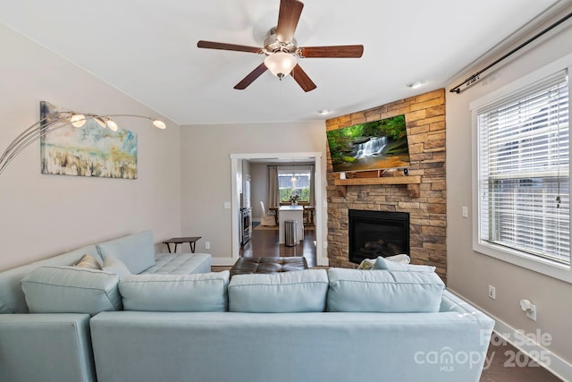19 Wetland Way, Arden, NC 28704 - living room featuring baseboards, ceiling fan, dark wood-style floors, and a stone fireplace