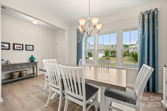1918 Thoreau Way, York, SC 29745 - dining room featuring a chandelier and light wood-style floors